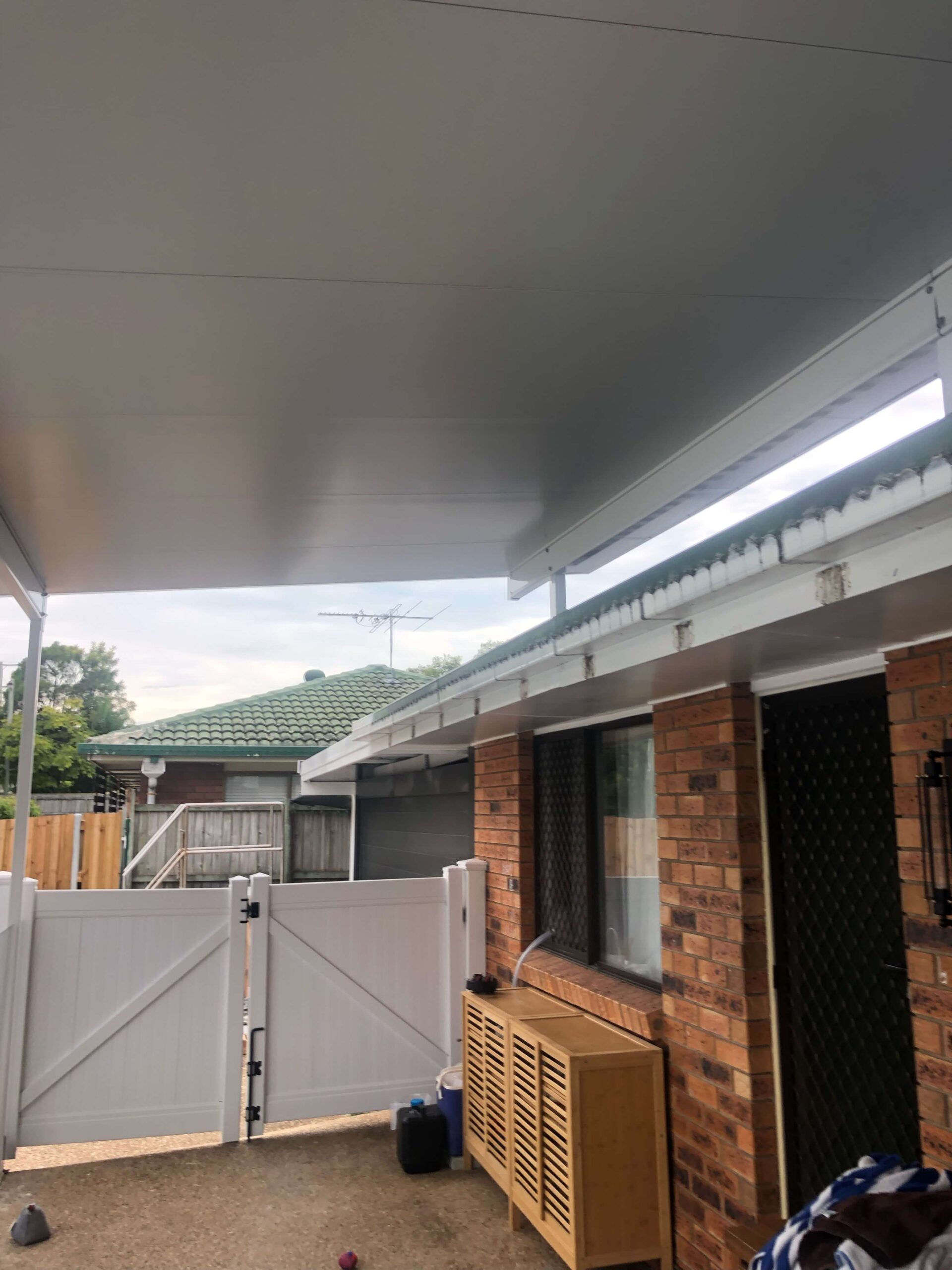 Insulated roof panels used to build a flyover patio attached to the roof of the house