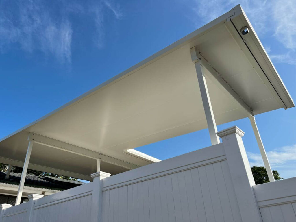 Insulated roof panels installed on a patio over a pool